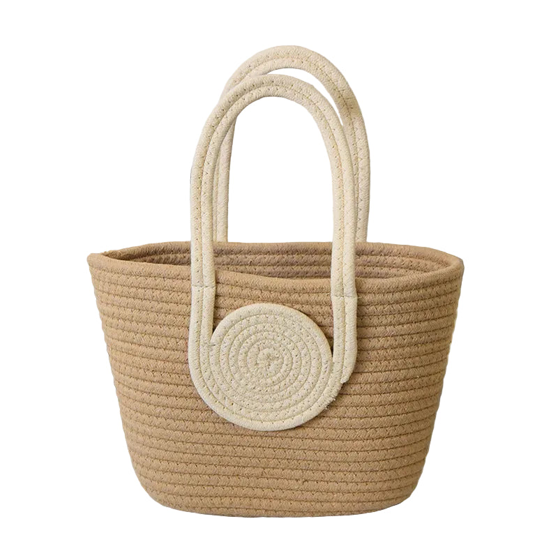 Woven basket with circular handle on a light surface